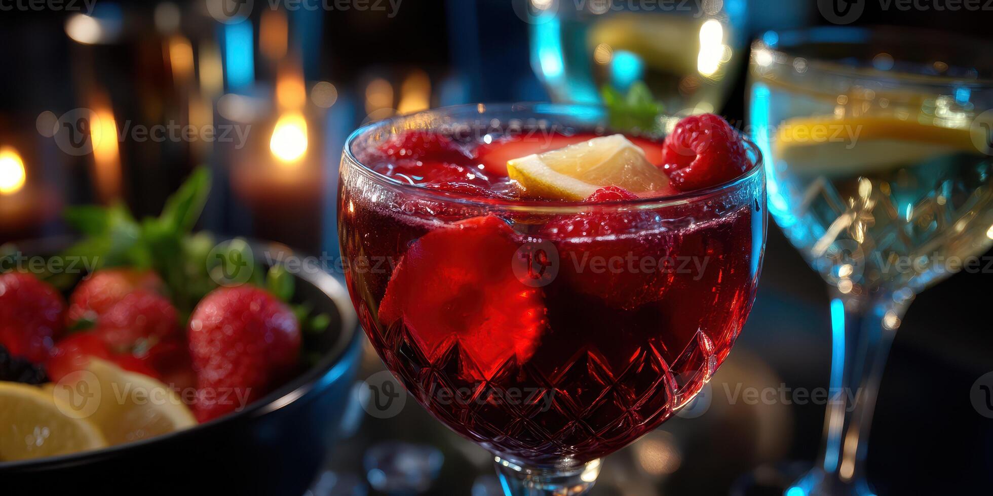 Refreshing summer cocktail garnished with fruit and served in an elegant glass at a celebration photo