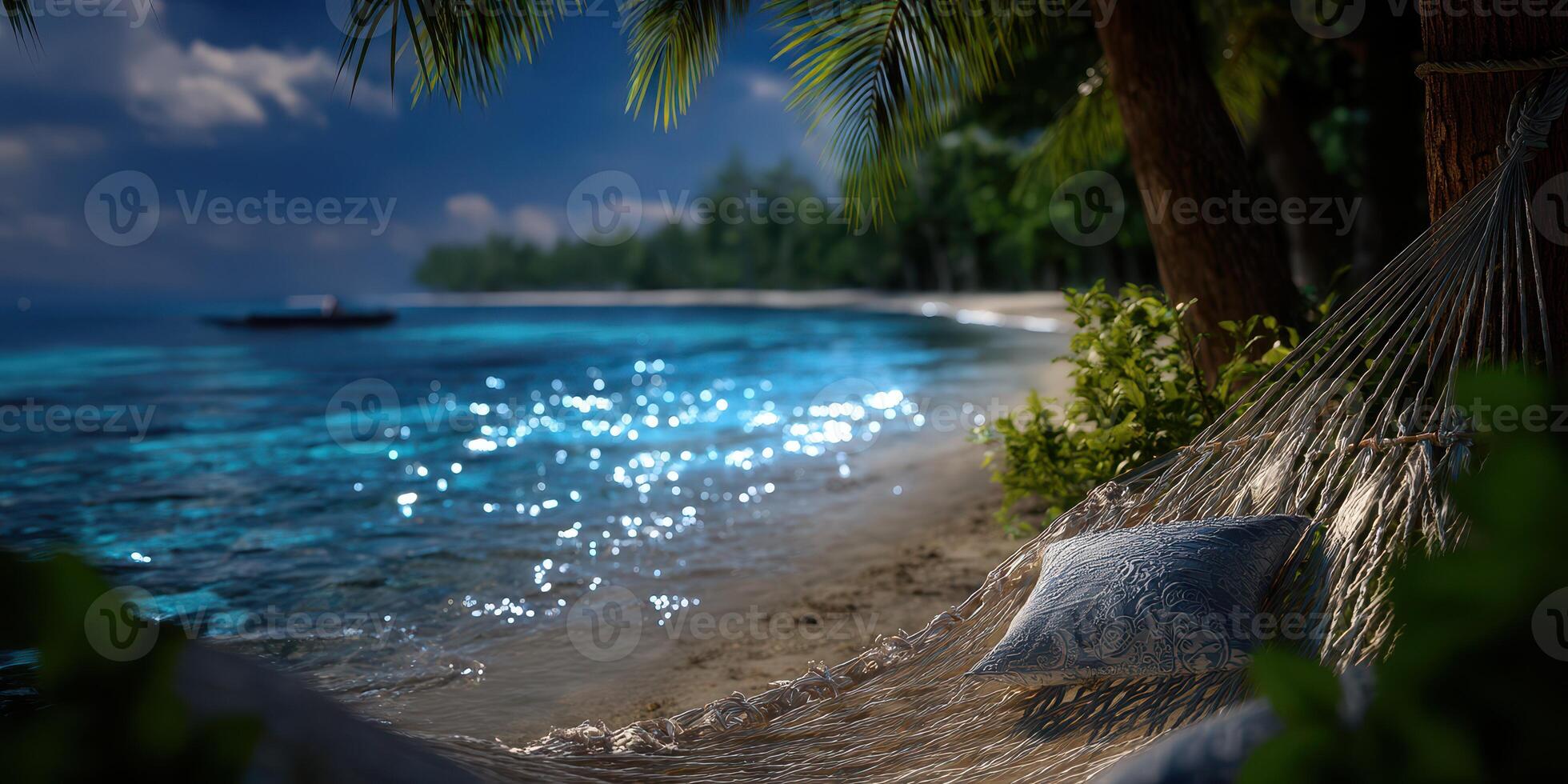 Relaxing hammock by the serene beach with turquoise water and lush palm trees under a clear blue sky photo