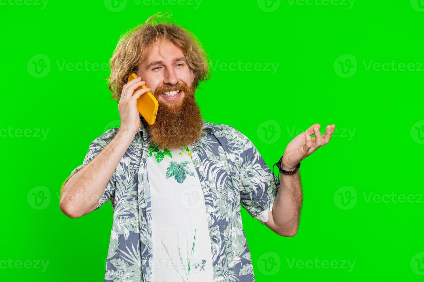 Happy surprised man involved in pleasant conversation phone call good news enjoying talking gossip photo