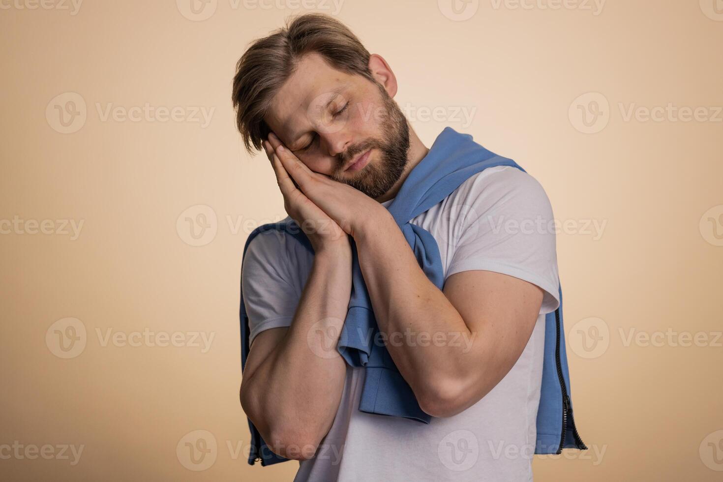 Young man yawning, sleepy inattentive feeling somnolent lazy bored gaping suffering lack of sleep photo
