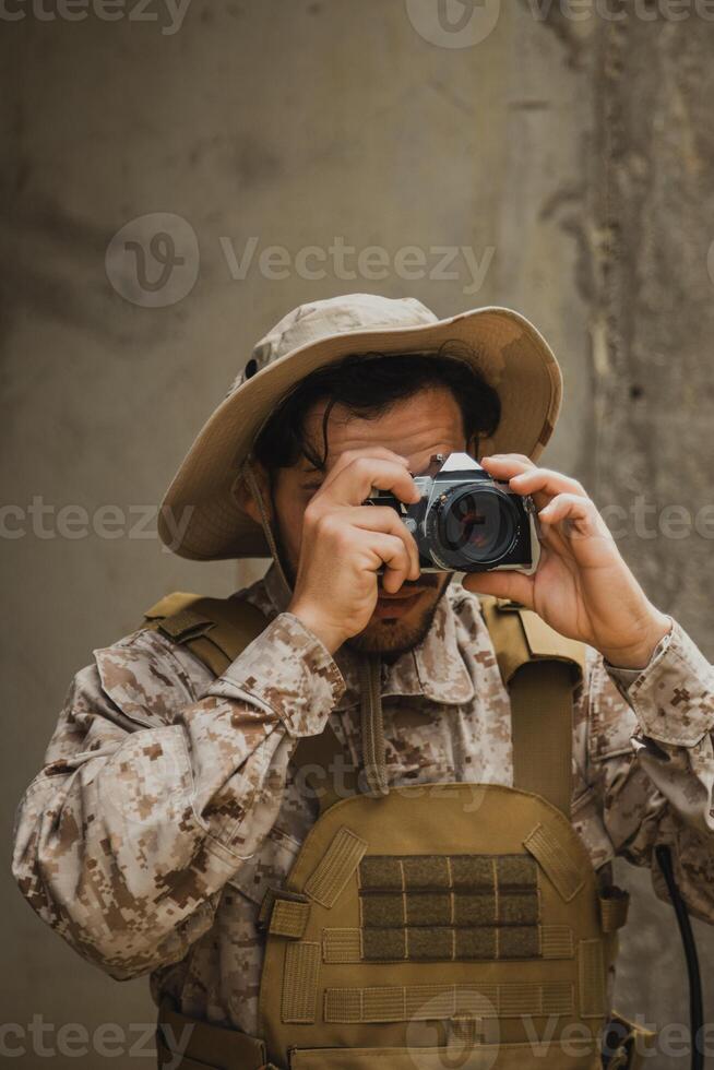 Soldier With A Camera Shooting Photos At The Enemies Tracks