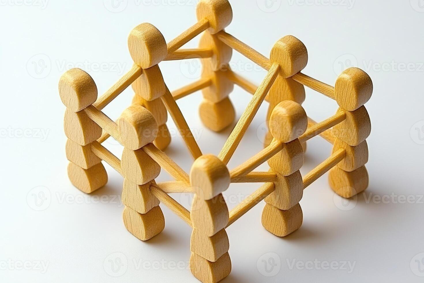 Interconnected wooden figures. A group of people connected by sticks, forming a lattice. A strong community concept, emphasized by the interwoven figures photo
