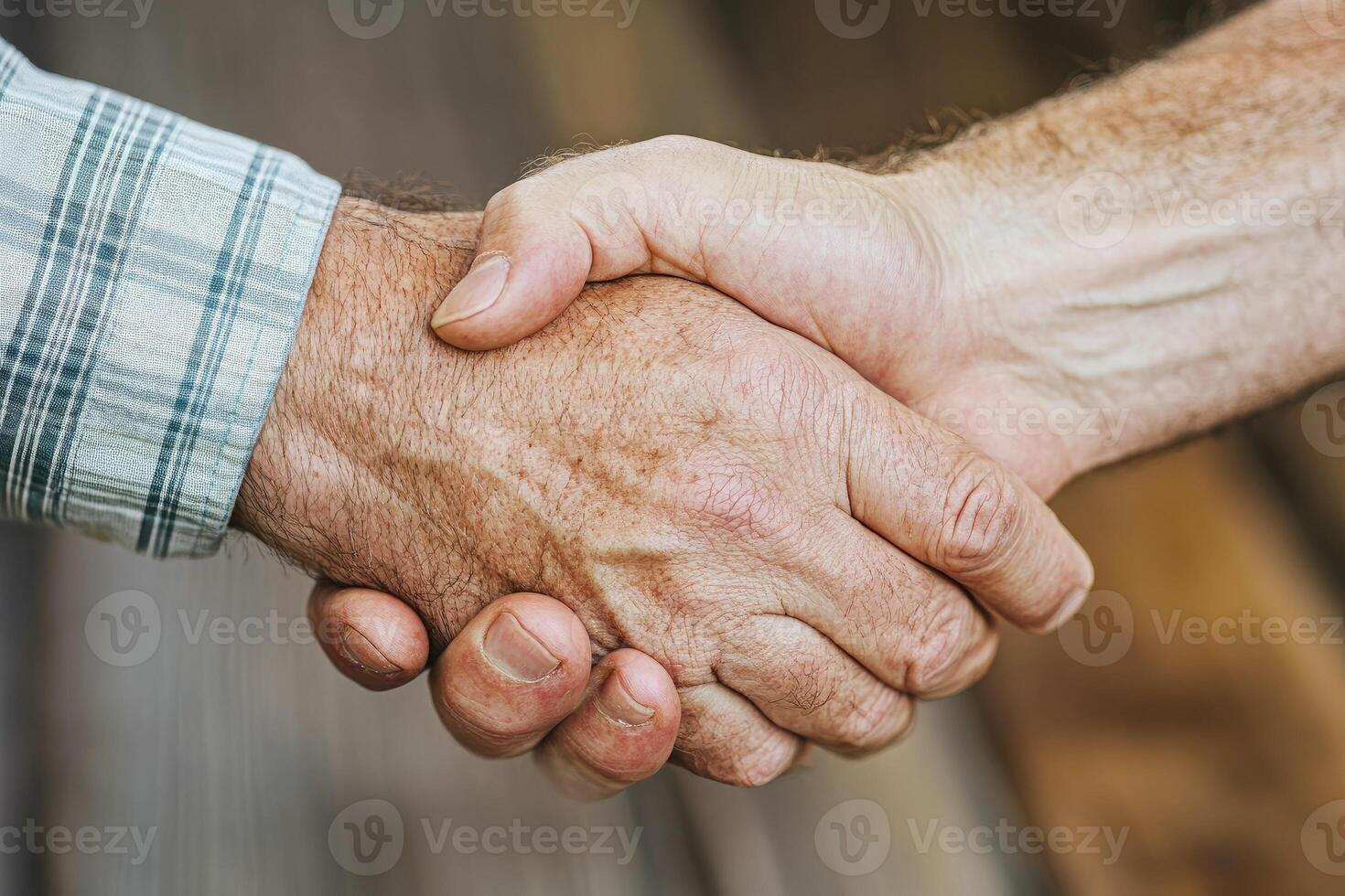 Close-up of a handshake. Two men's hands clasped firmly photo