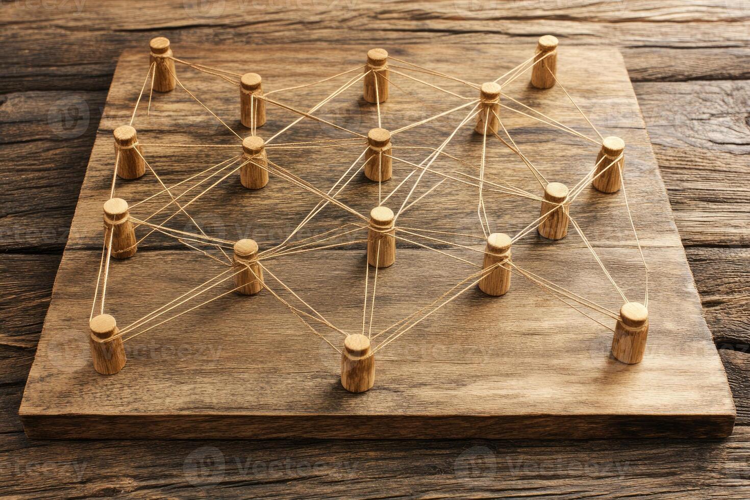 A wooden board with a bunch of wooden sticks photo