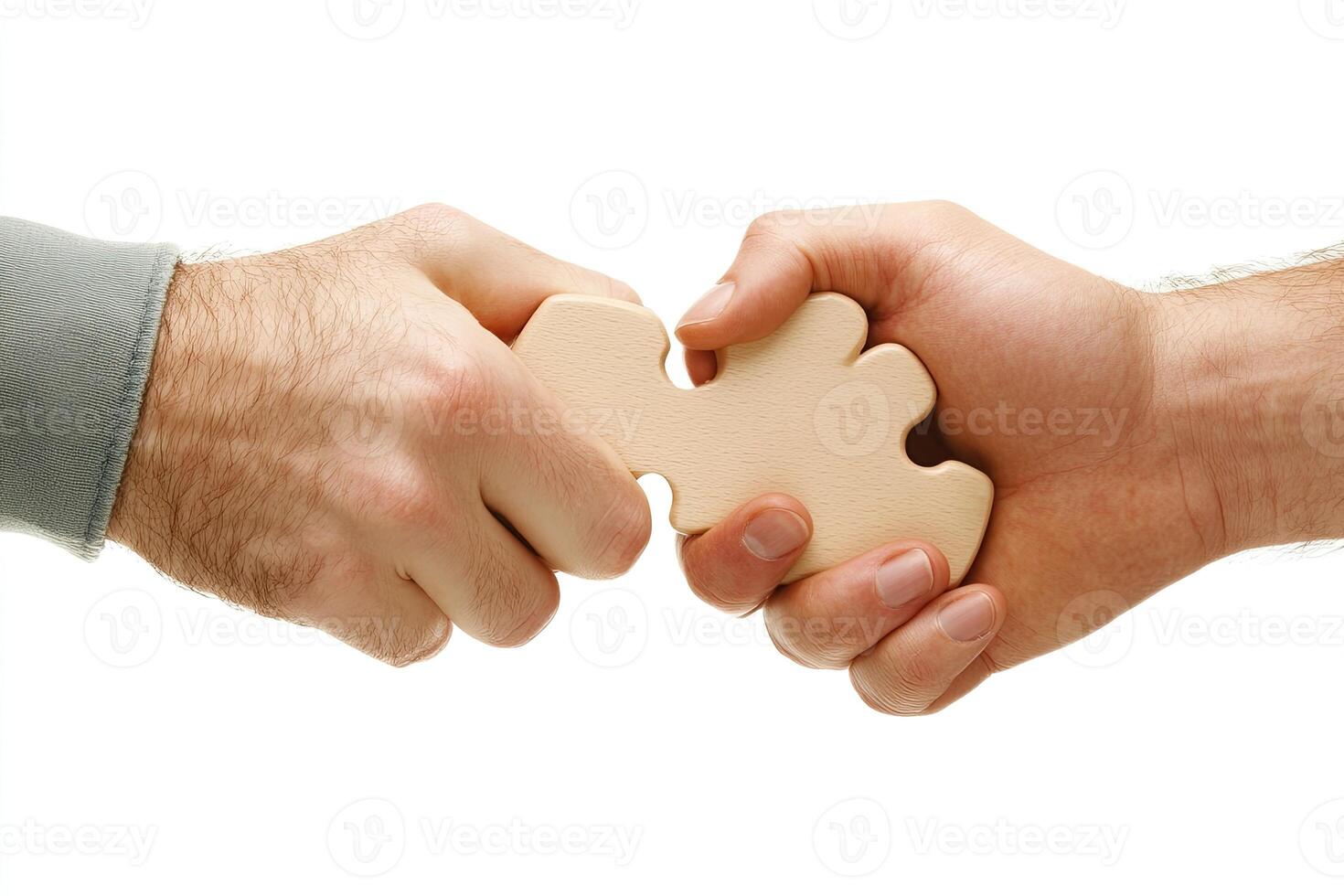Two hands holding a wooden puzzle piece, symbolizing collaboration photo