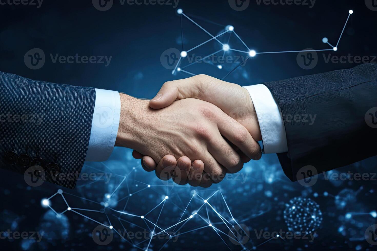 Businessmen shaking hands over networked background photo
