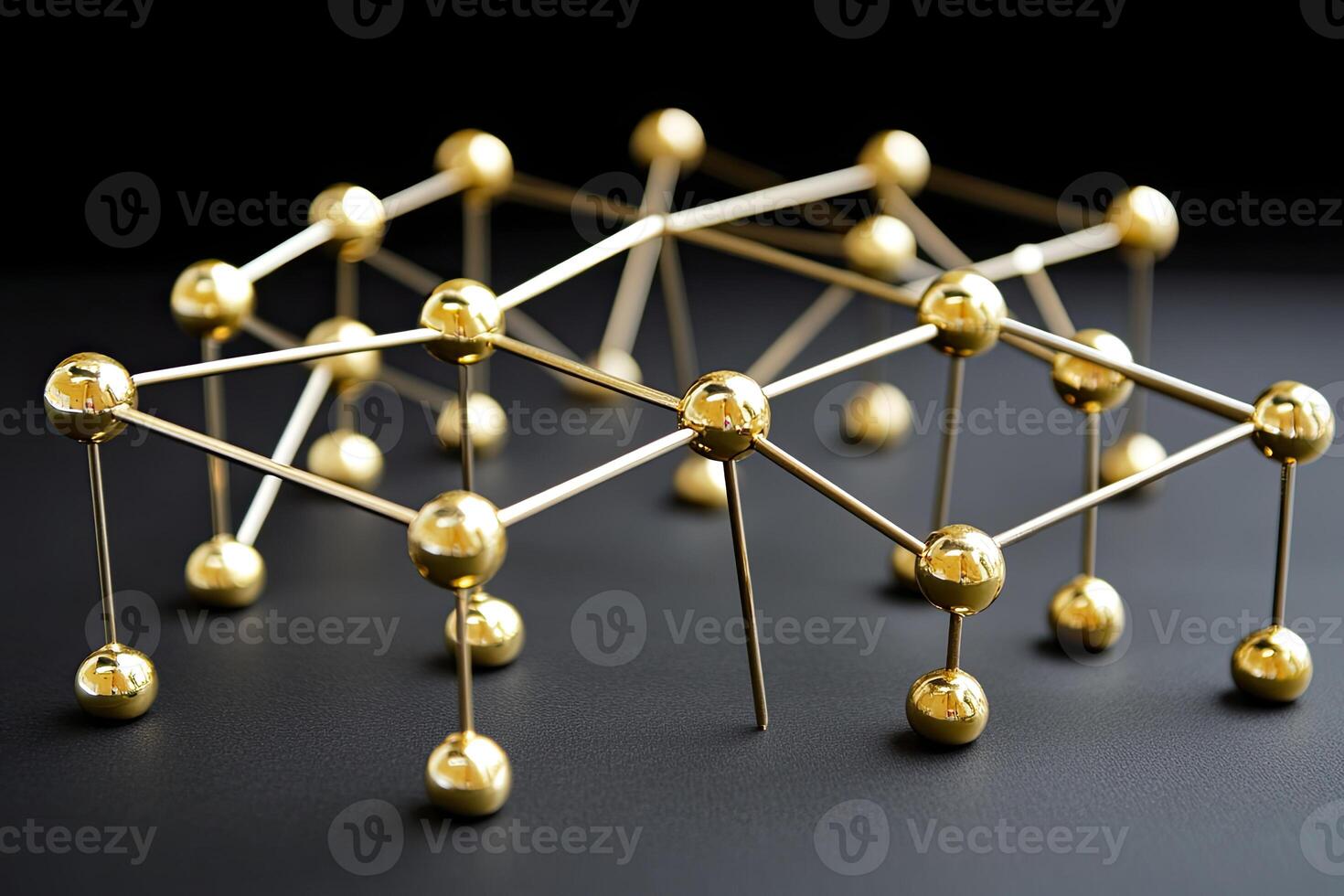 Golden spheres connected by metallic rods, forming a complex network photo