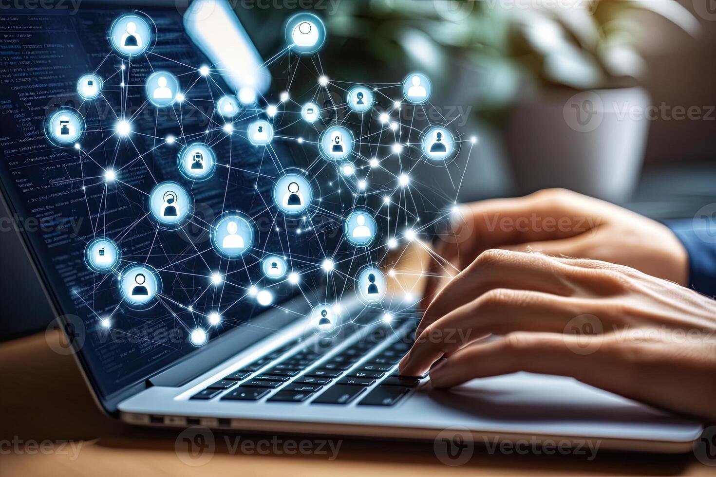 Person working on a laptop with a network of user profiles photo