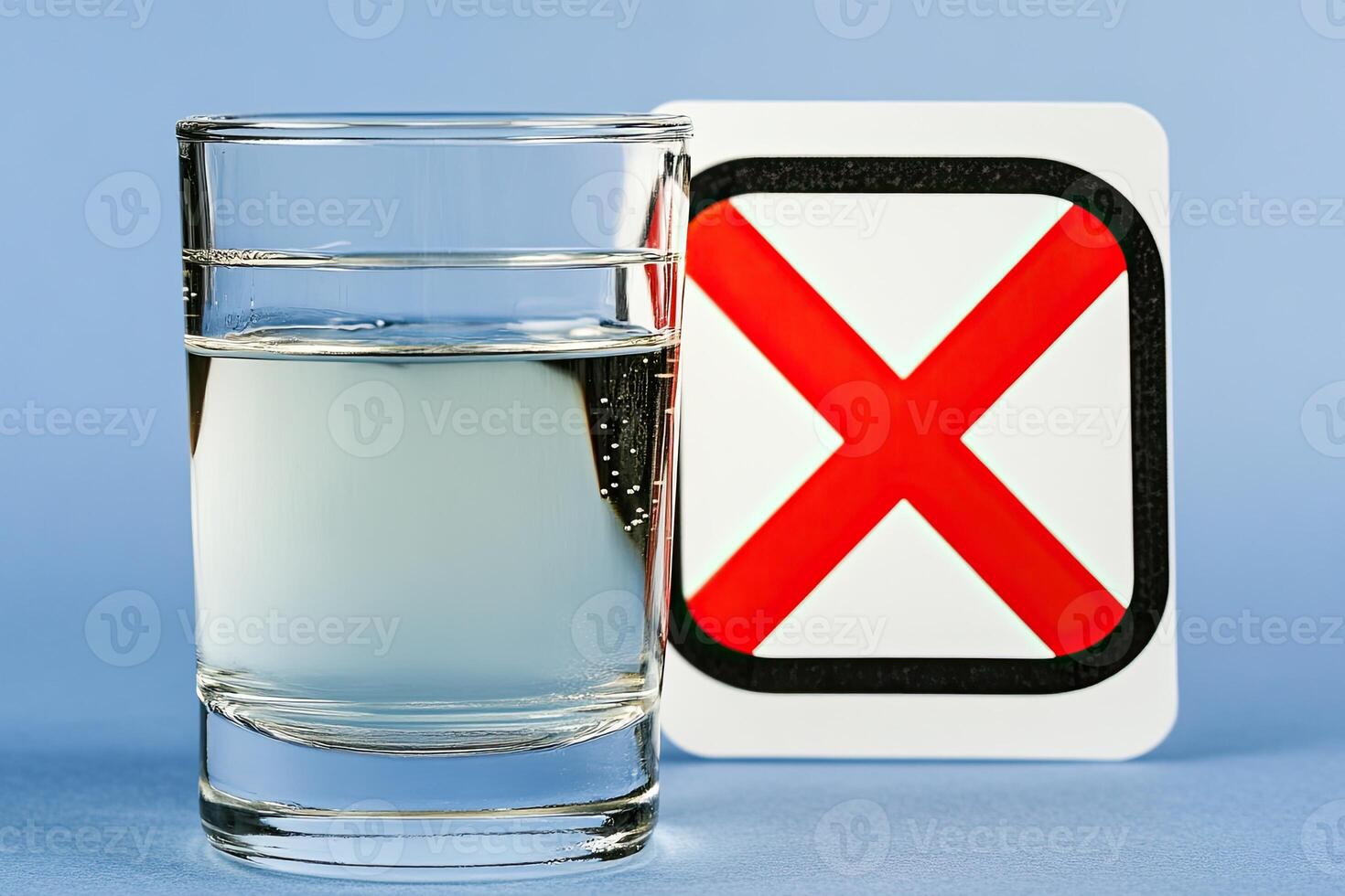 Clear glass of water beside a no symbol photo