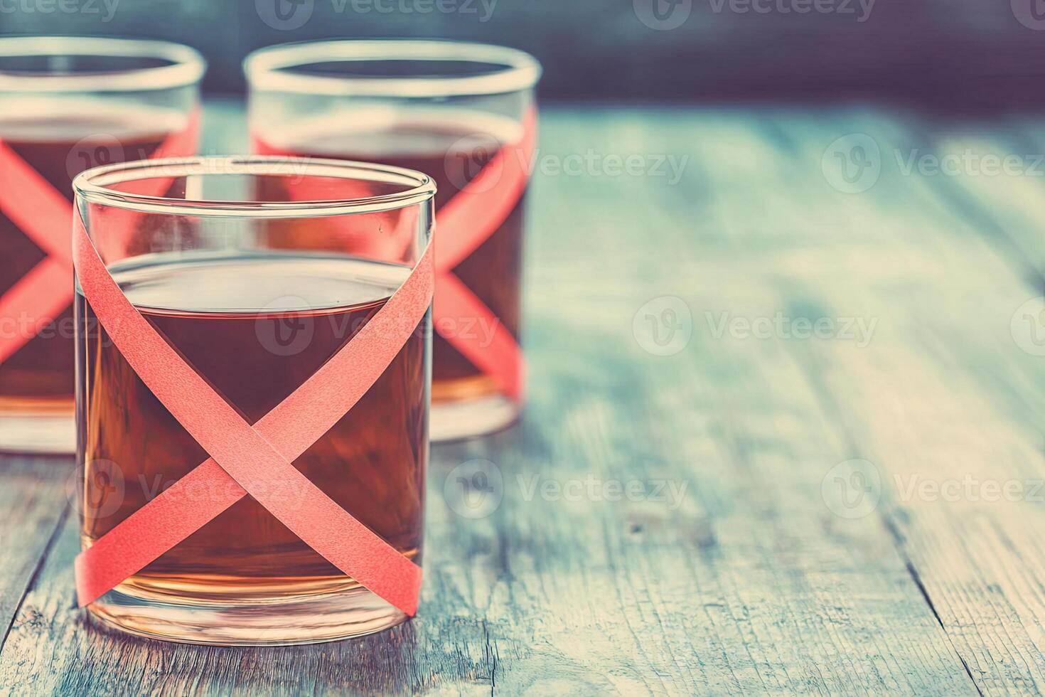 Three glasses of dark liquid with decorative ribbons photo
