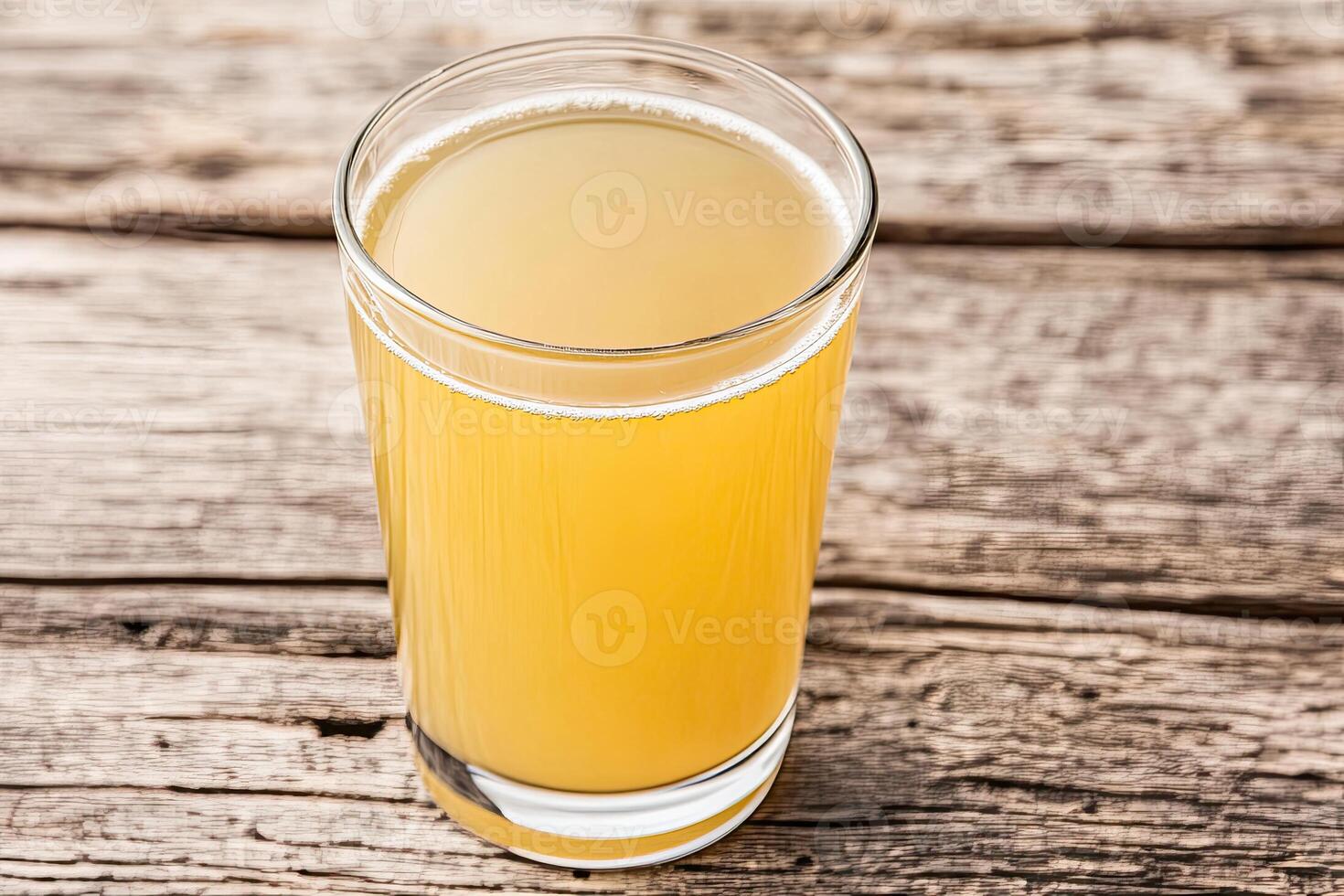 Light golden drink in glass photo