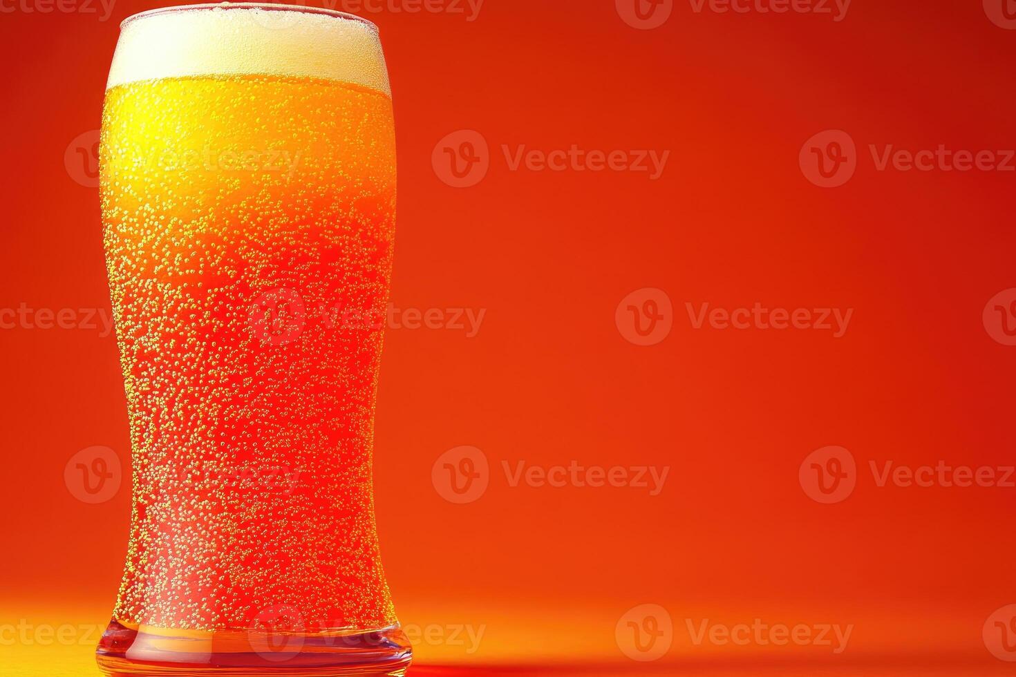 A glass of light-colored beer photo