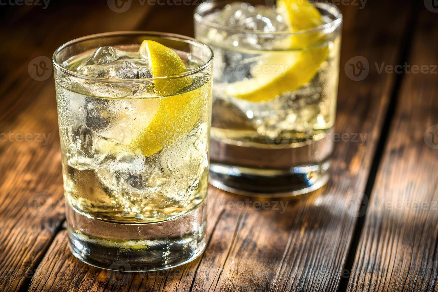 Two refreshing cocktails garnished with lemon slices photo