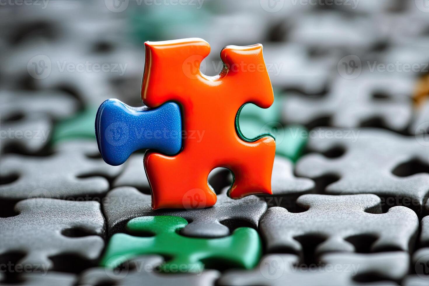 A single orange puzzle piece fits perfectly into a larger gray puzzle photo