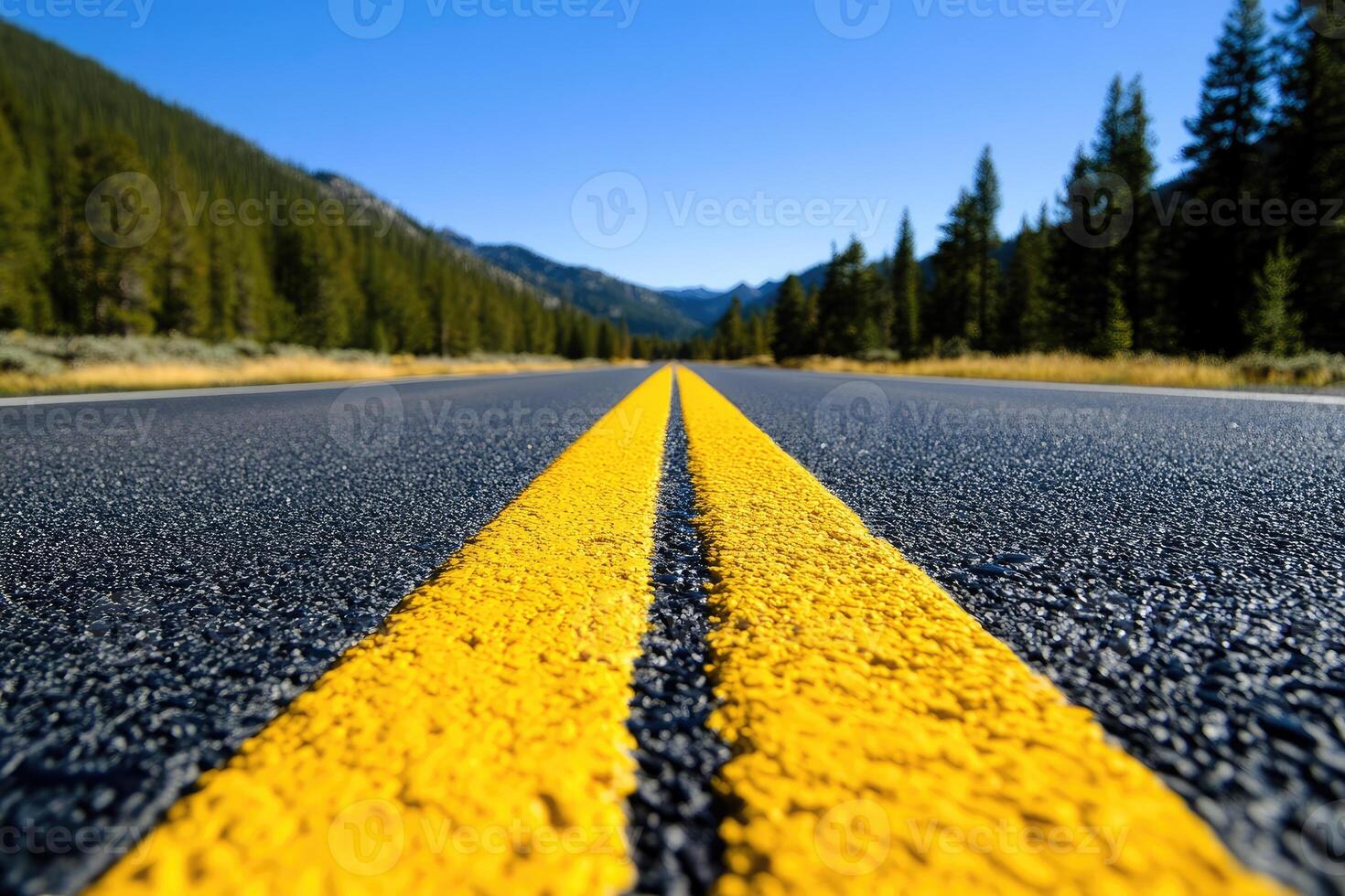 Highway stretching into mountain scenery photo