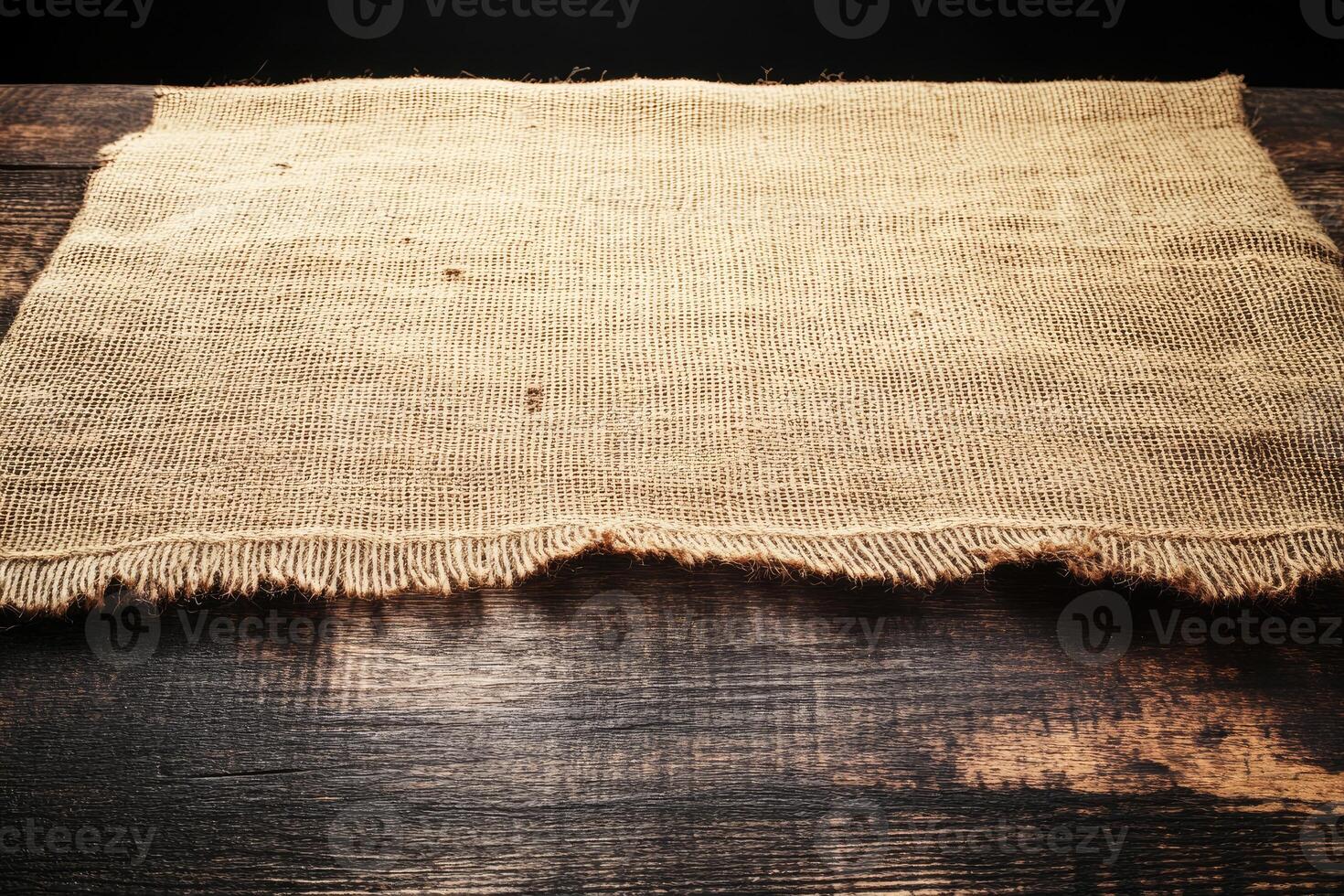 Rustic burlap tablecloth on wooden table photo