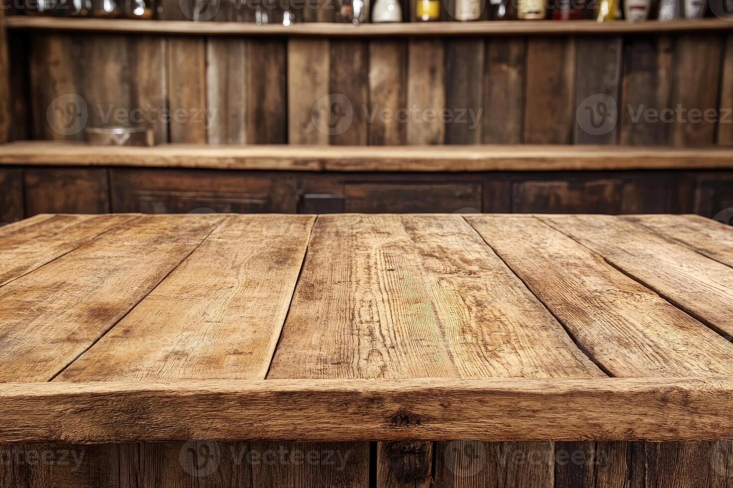 A wooden bar top with a shelf of bottles photo