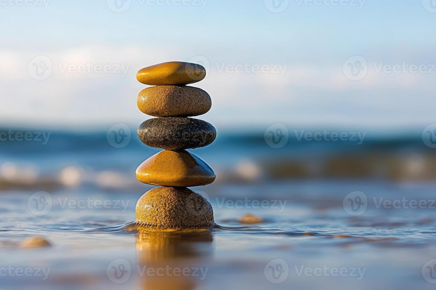 Balanced stones on beach photo