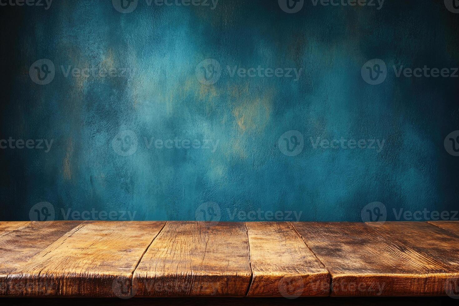 Rustic wooden table against teal backdrop photo