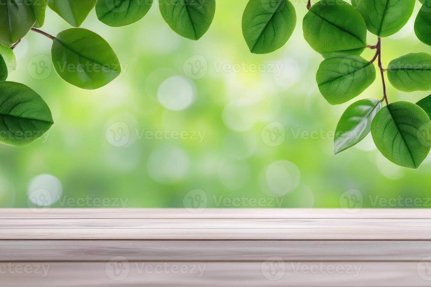 Empty light wooden table with green leaves and bokeh photo