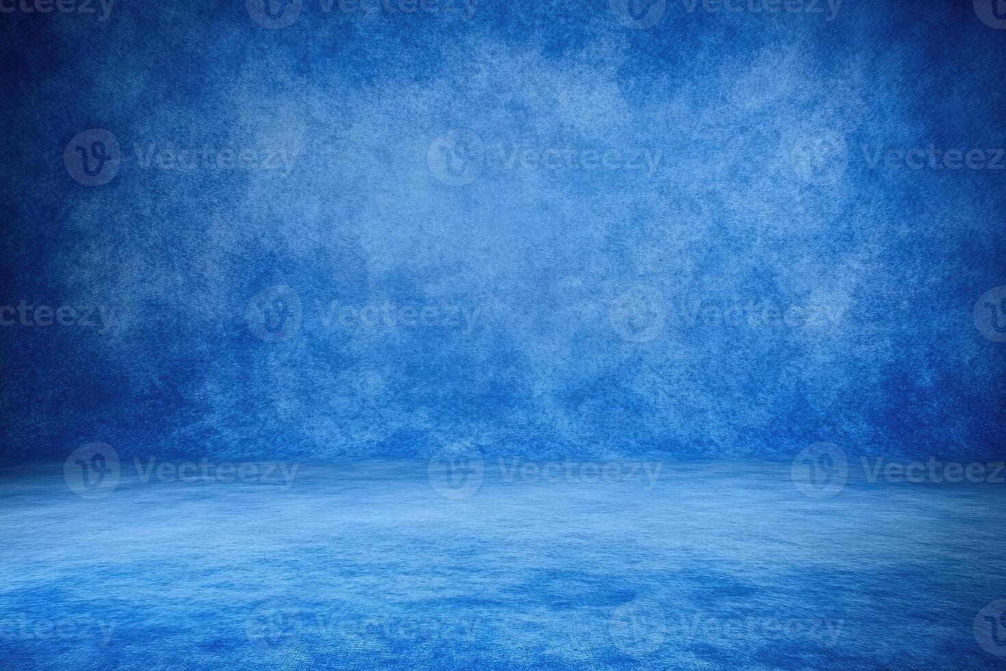 A vast, deep blue studio backdrop with textured walls and a smooth floor photo