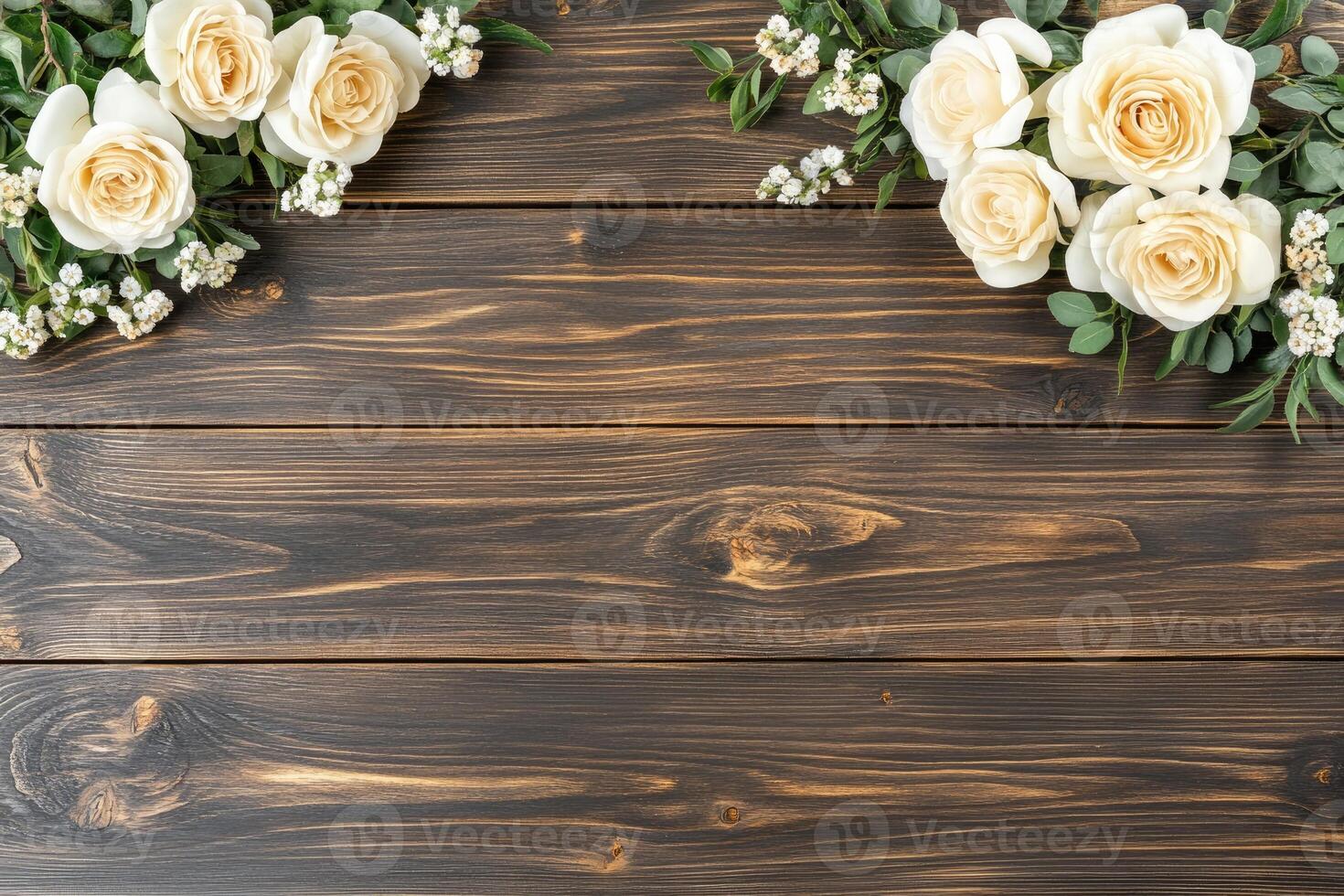 Cream roses and greenery on dark wood photo