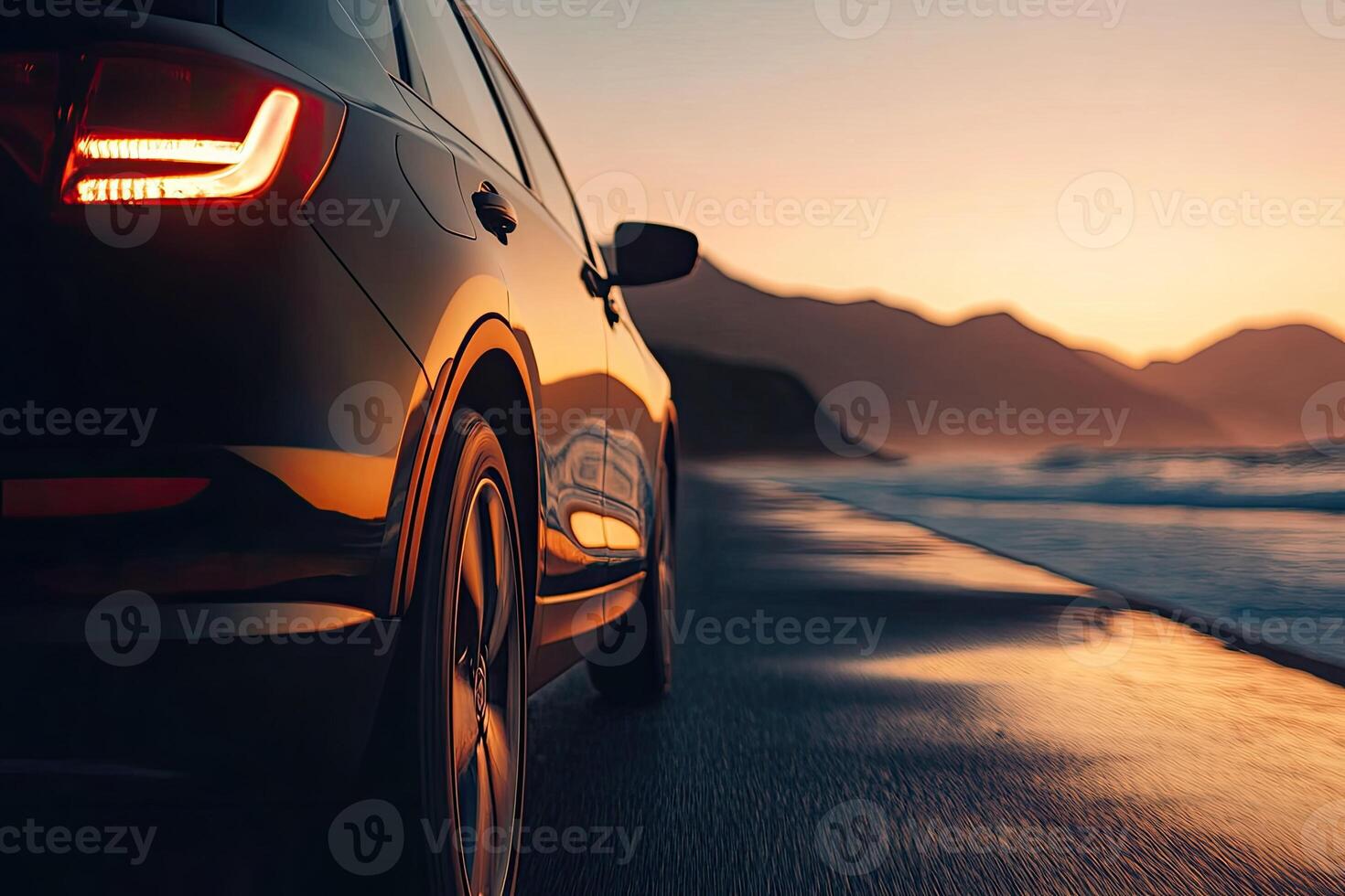 Dark SUV on a beach at sunset photo