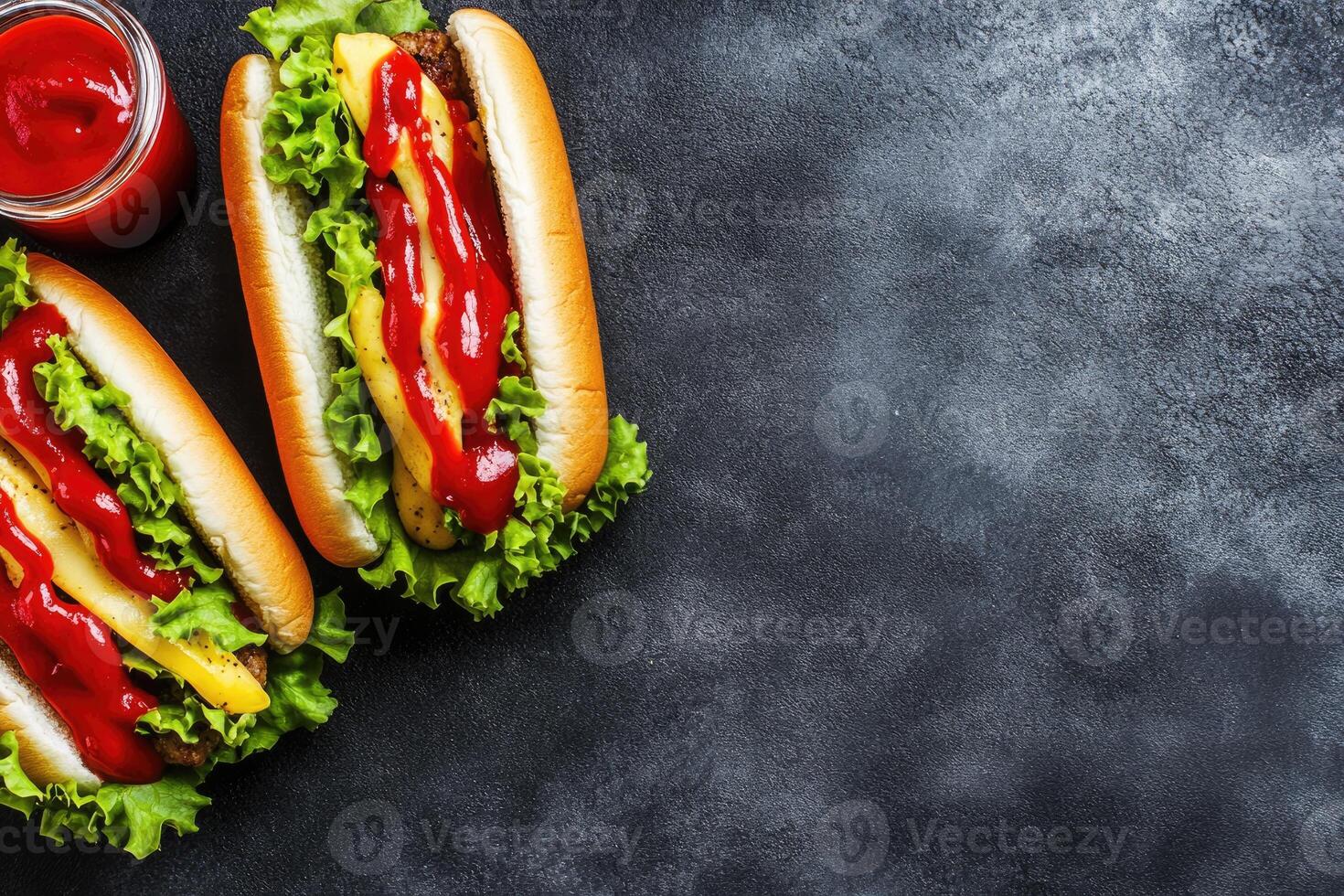 Two gourmet hot dogs with toppings photo