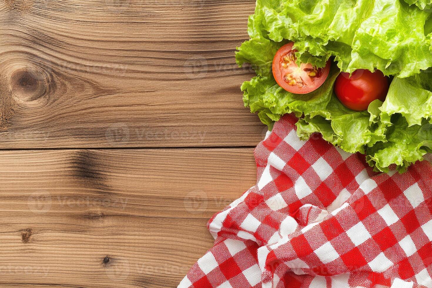 Fresh salad ingredients on a wooden table photo
