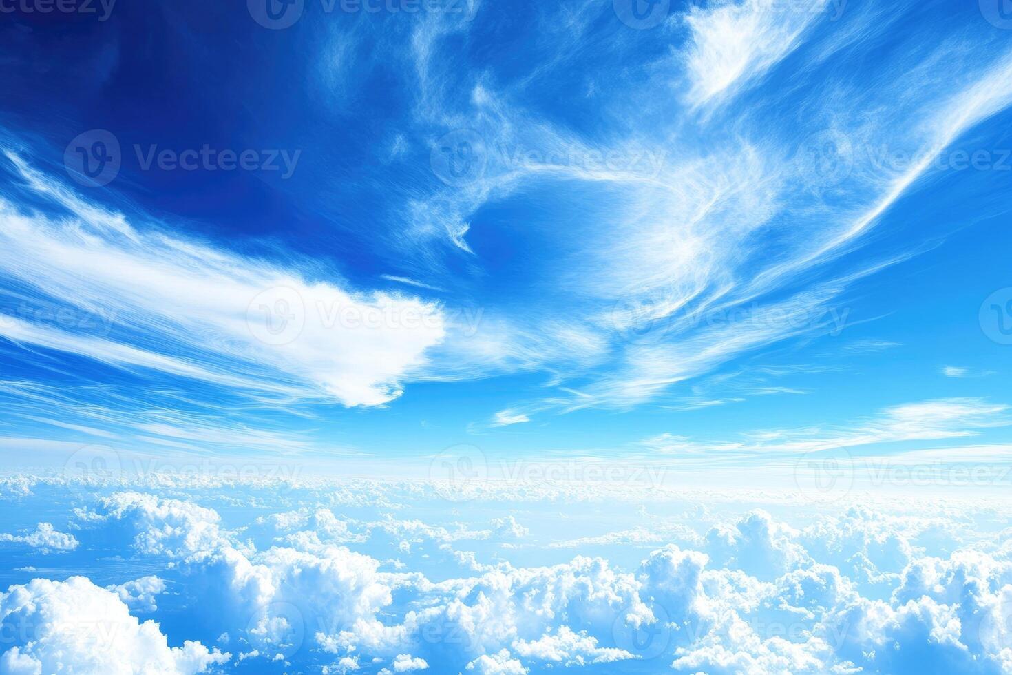 Vast expanse of a vibrant blue sky filled with fluffy white clouds photo
