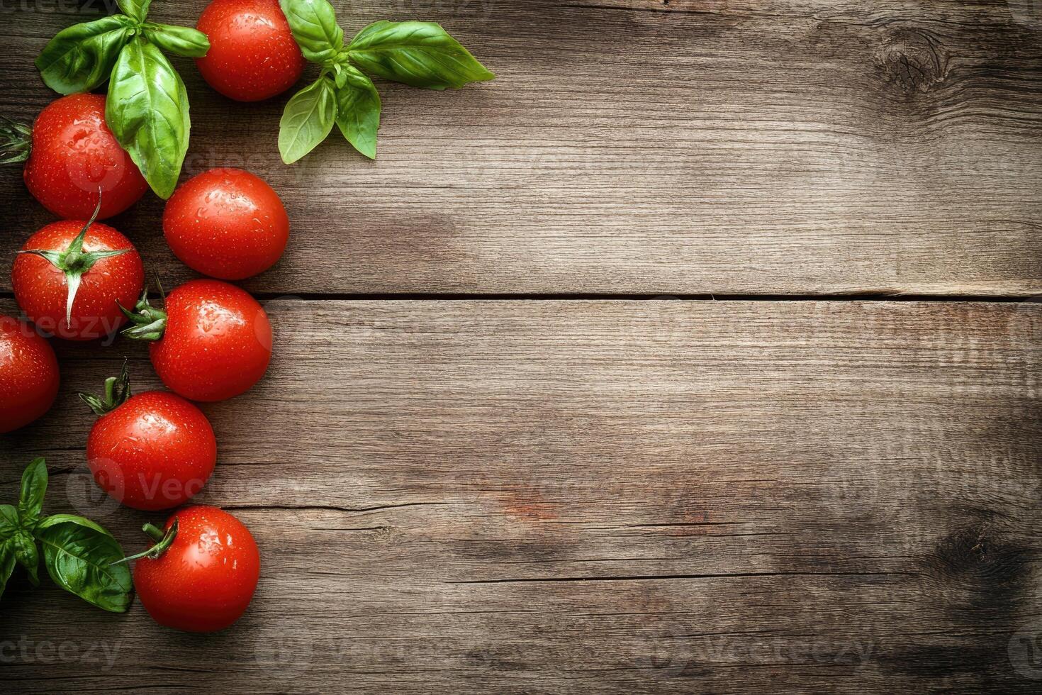 Fresh tomatoes and basil on a rustic wooden table photo