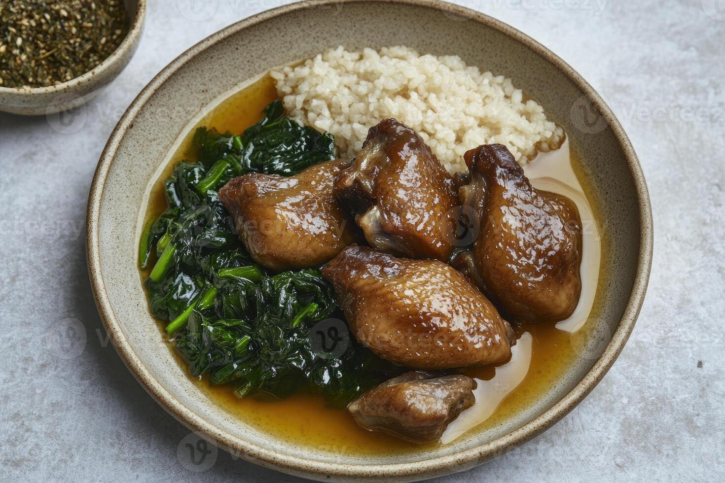 Chicken and rice with spinach in a bowl photo