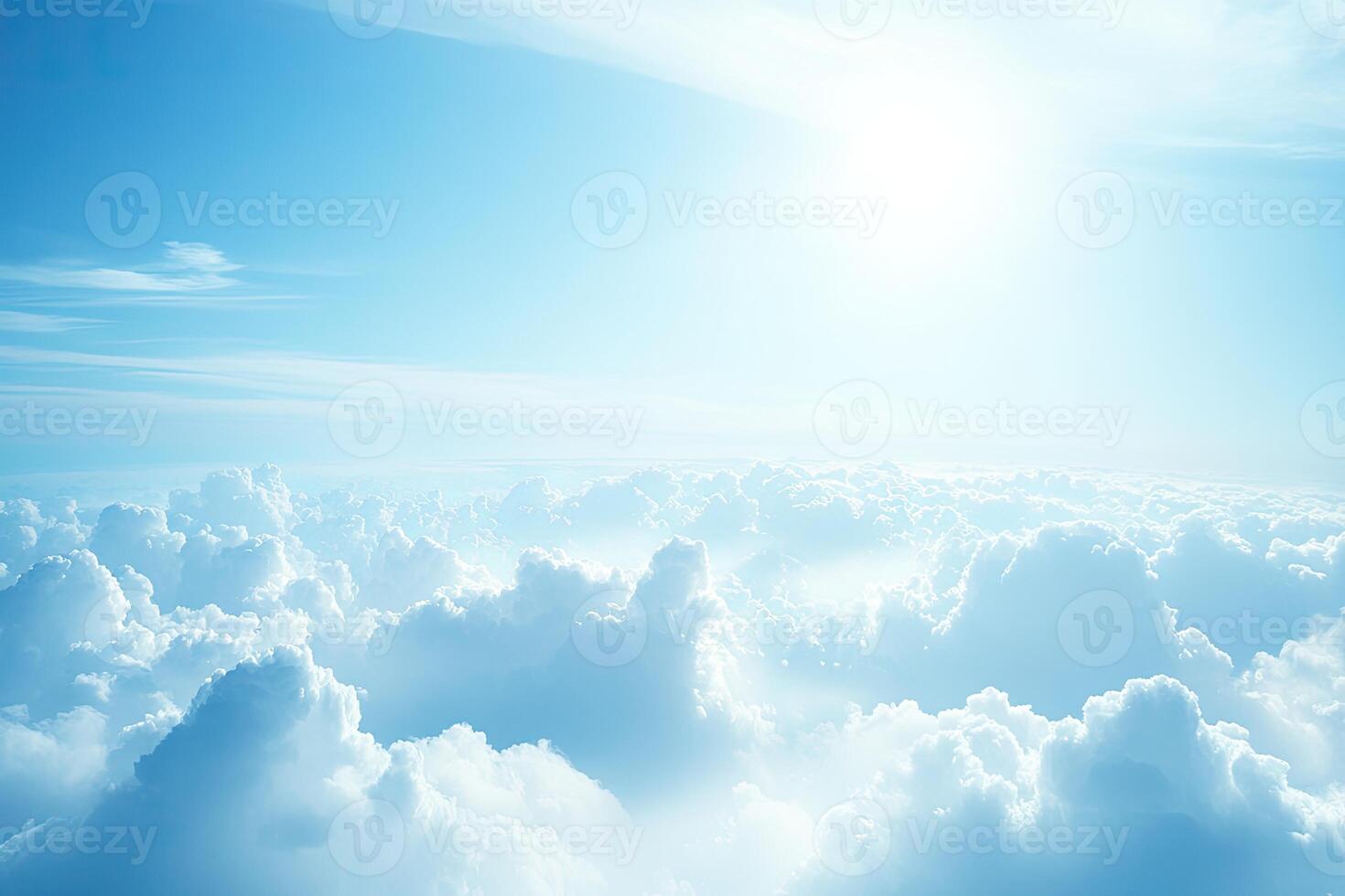 Vast expanse of fluffy clouds under a brilliant sky photo