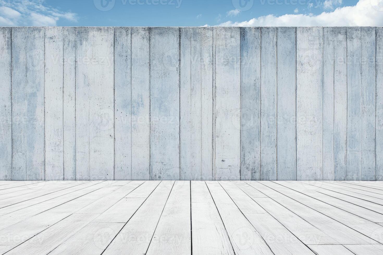 Light gray wood panel wall and white wooden floor against a blue sky photo
