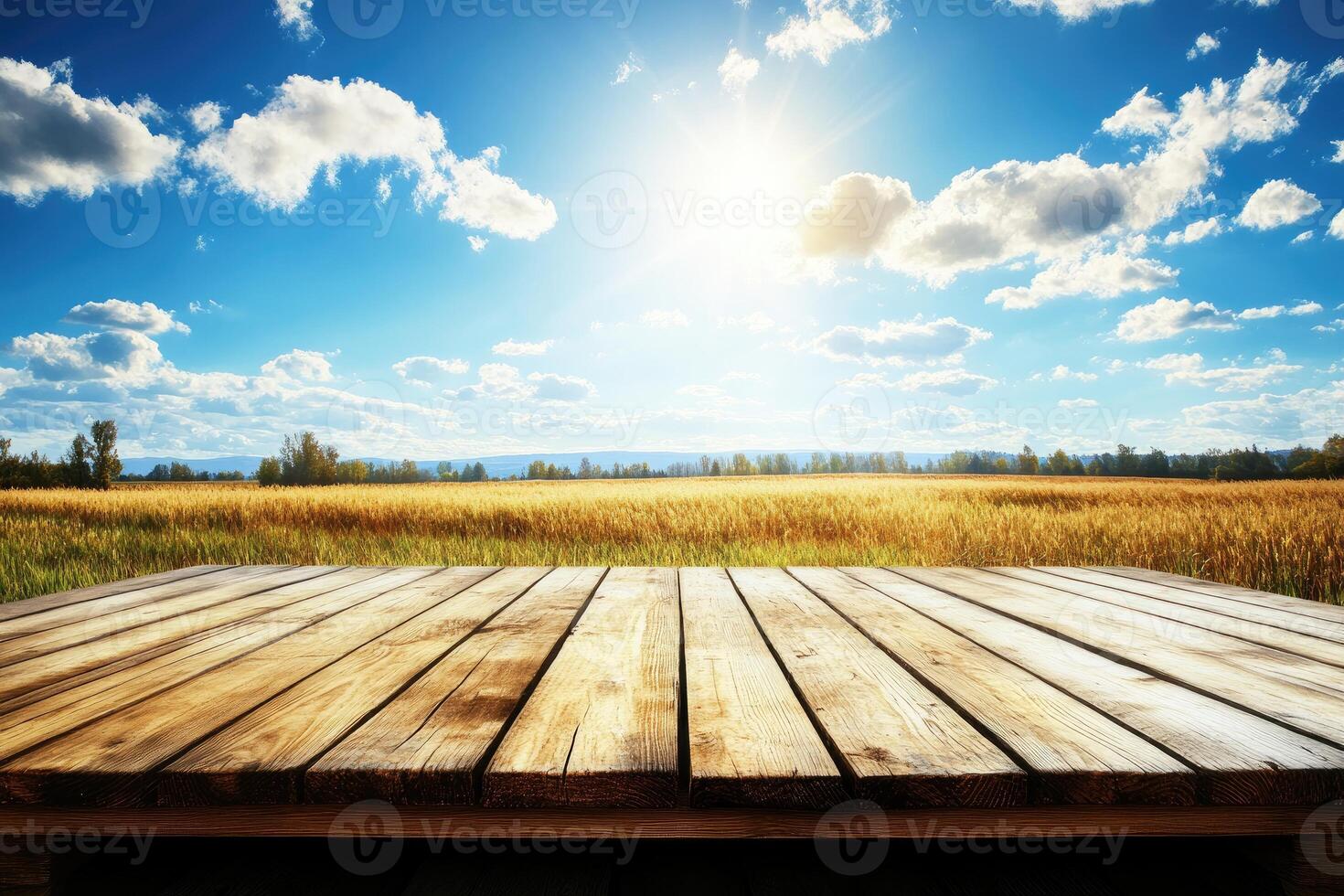 Rustic wooden surface overlooking a golden wheat field under a vibrant summer sky photo