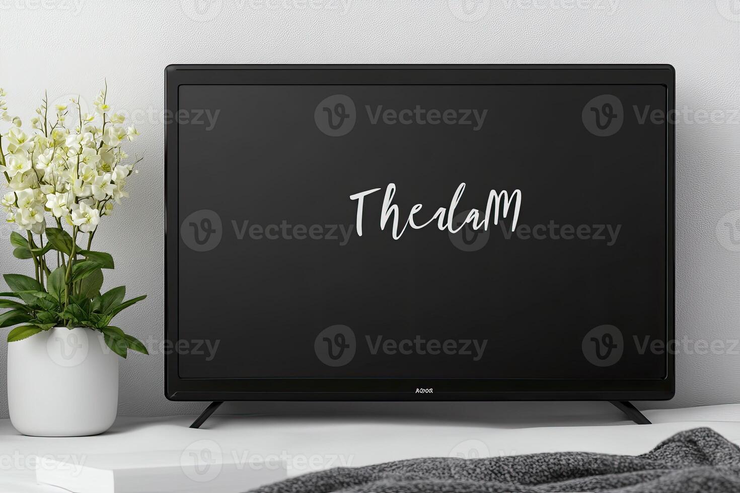 Modern flat-screen TV, presented in a stylish setting, featuring a clean design and a blank screen photo