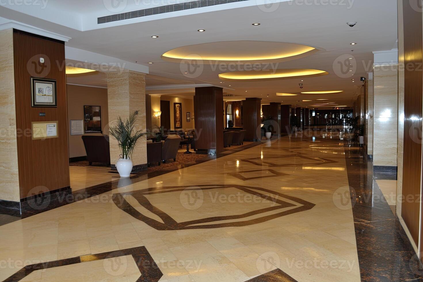 Elegant hotel hallway with polished floors and comfortable seating areas photo