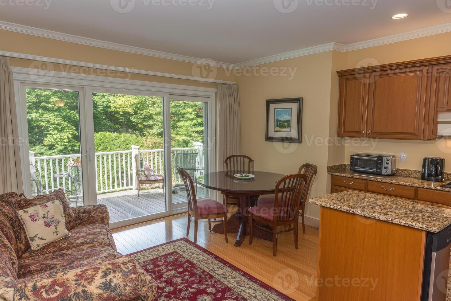 Bright, open-plan living area with patio access photo