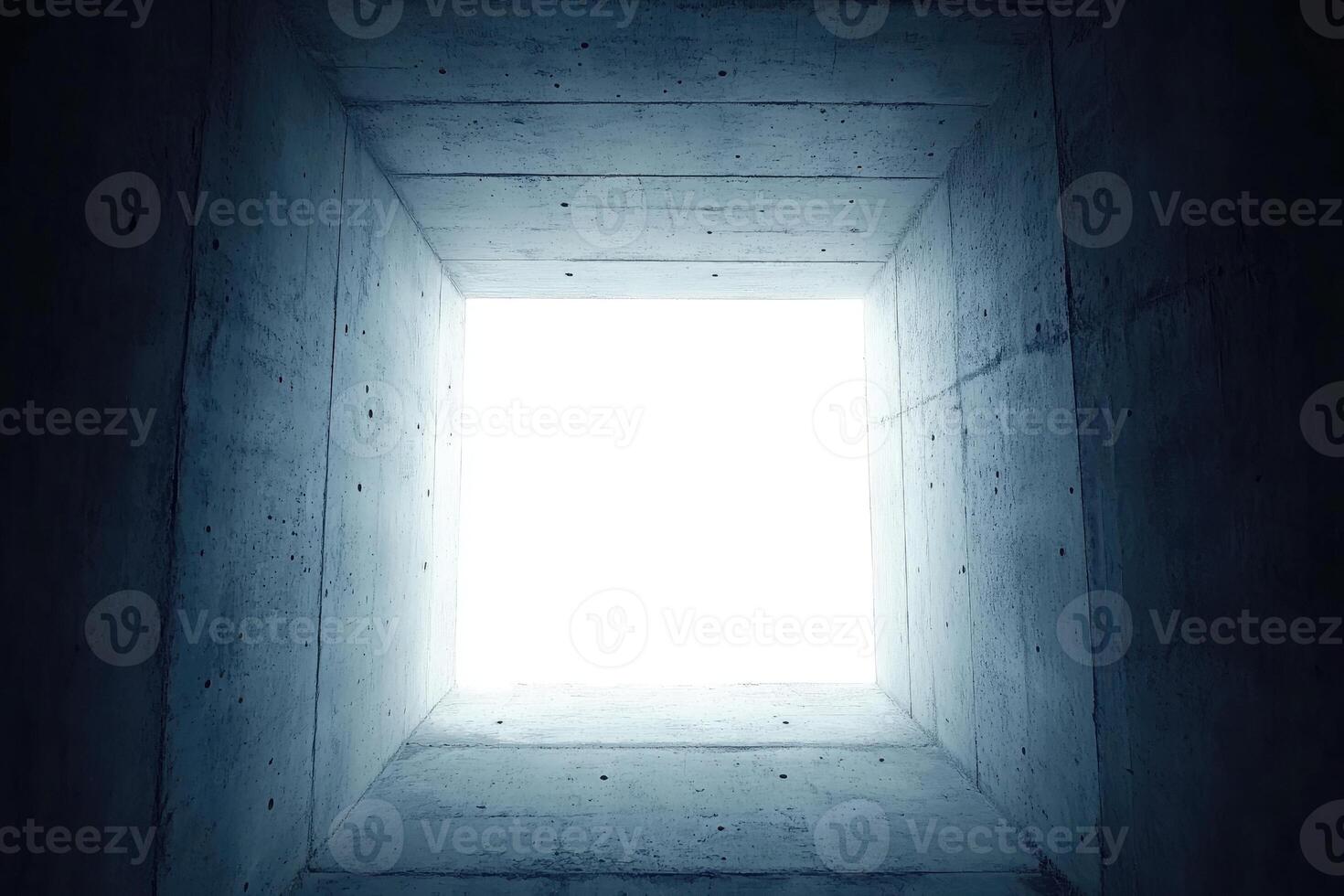 Concrete tunnel opening to bright light photo