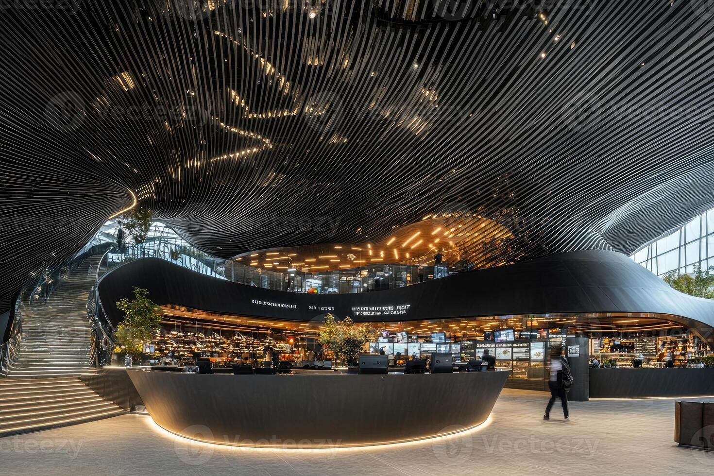 Modern, sophisticated, and dynamic interior design. Curved, metal ceiling creates a flowing effect. Open-plan layout with food service area photo
