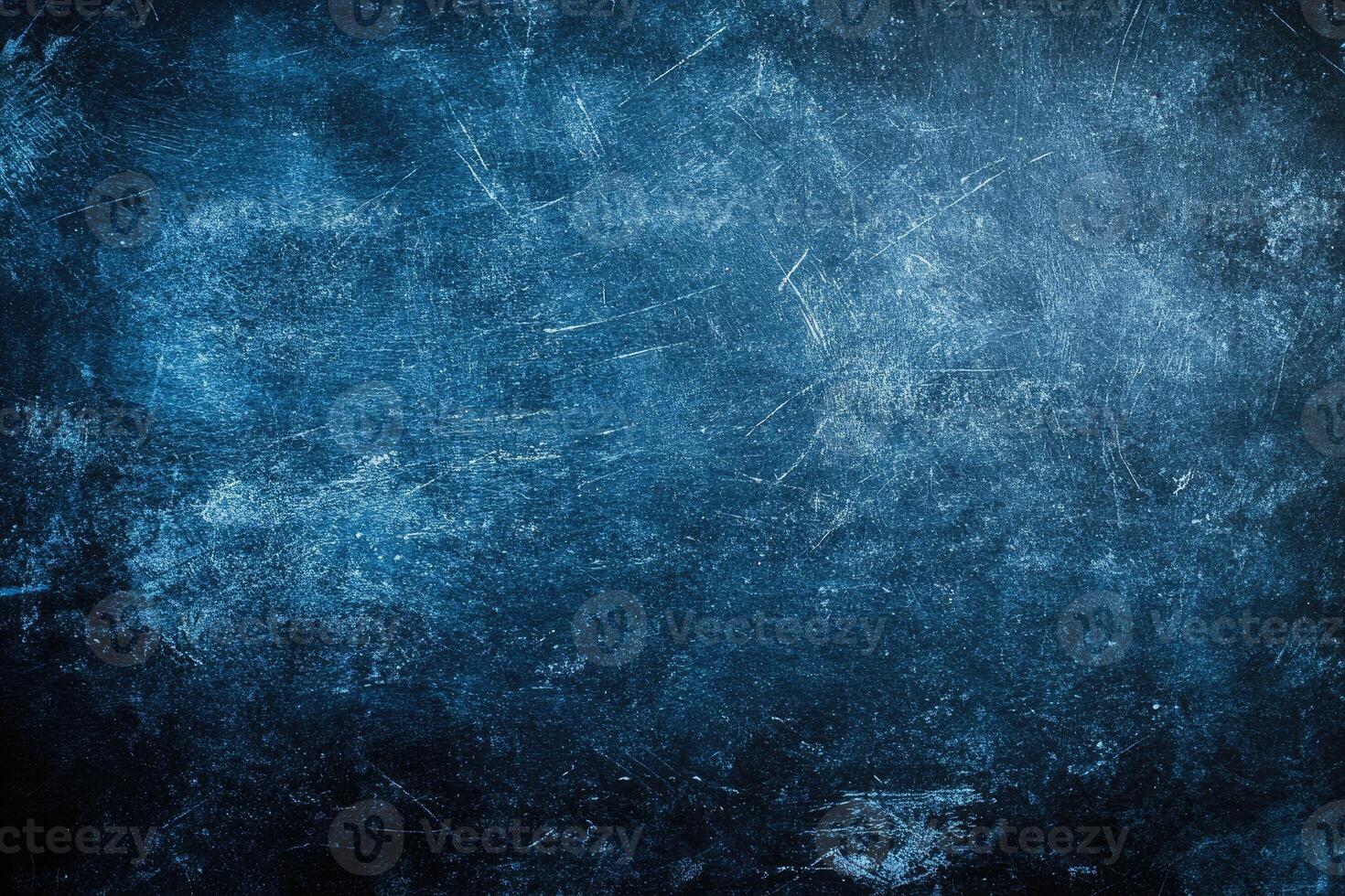 Dark blue textured surface with scratches and marks photo