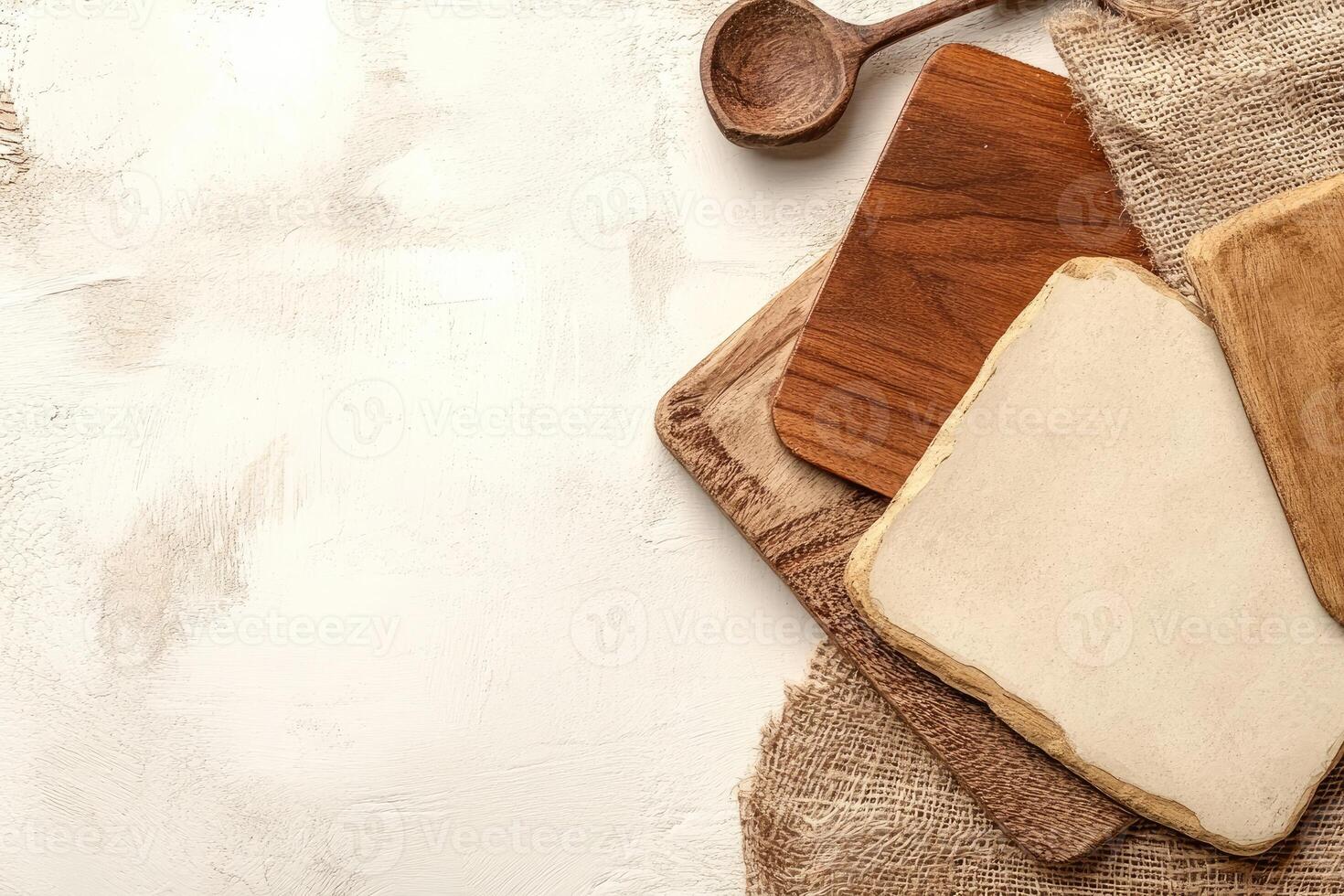 Wooden kitchen utensils on a textured surface photo