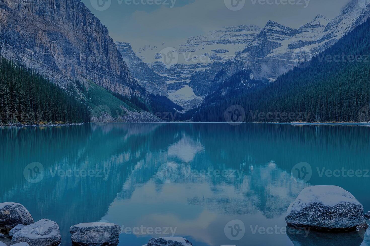 Serene mountain lake reflecting a tranquil sky photo