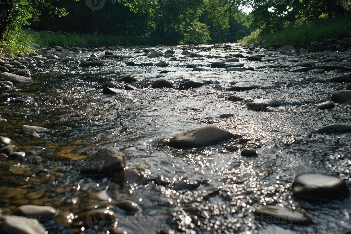 Clear, swift creek flowing over rocks photo