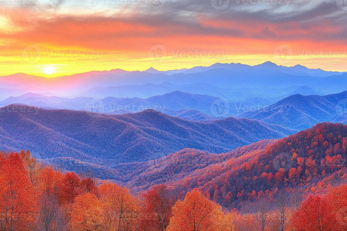 Autumnal mountain vista at sunrise. Layers of colorful peaks and forests bathed in the warm hues of a vibrant sunrise photo