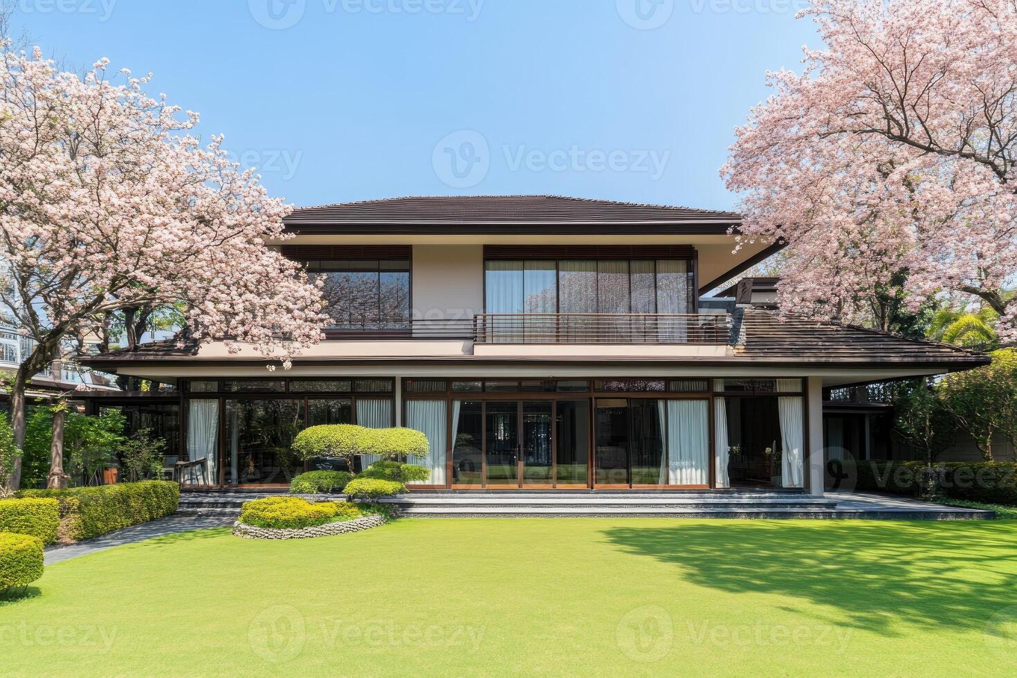 Spacious, elegant home with a serene garden and cherry blossoms photo