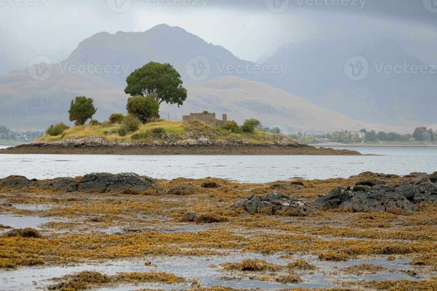 Isle with ruins, mountains and sea photo
