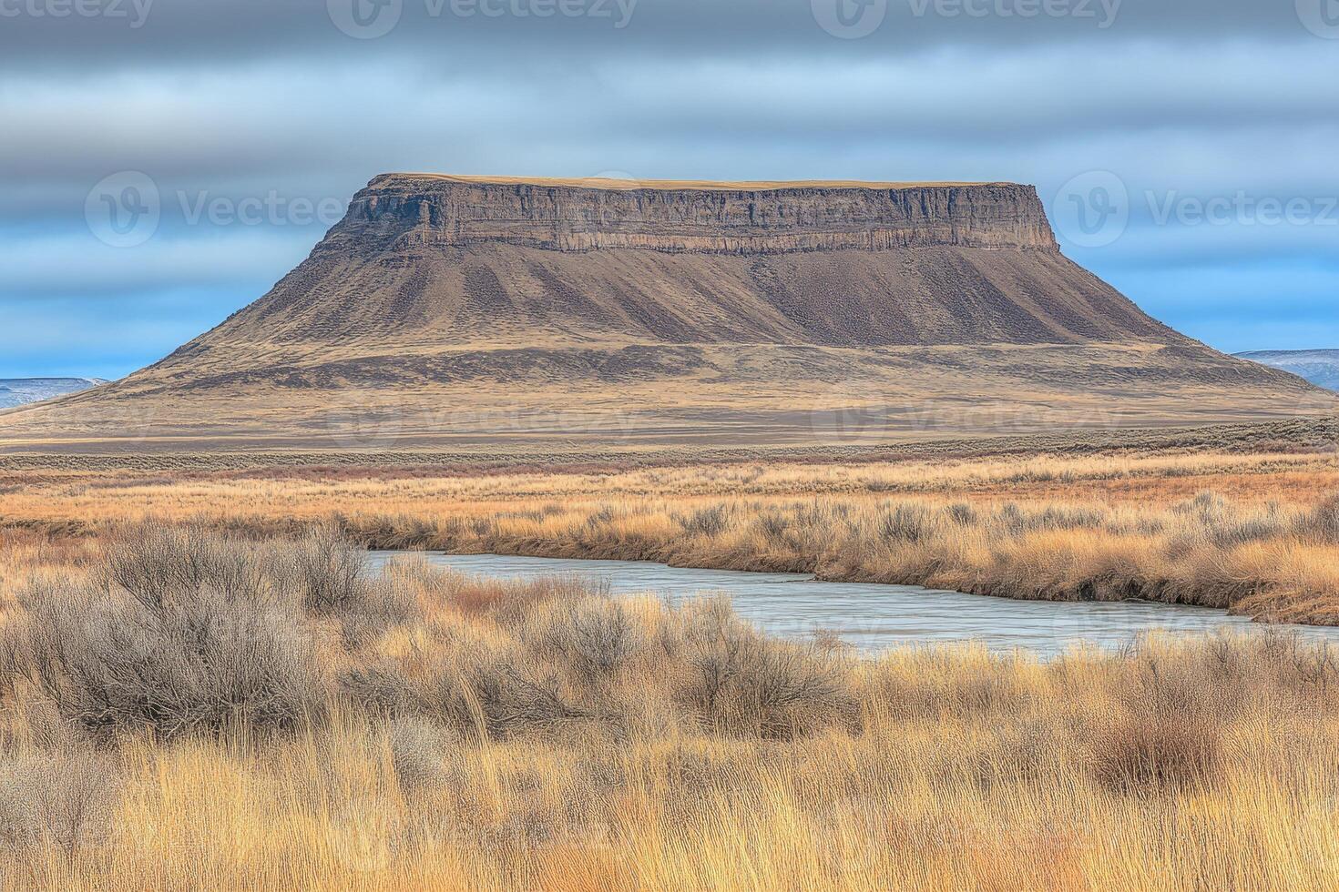Flat-topped mountain overlooking a river valley photo