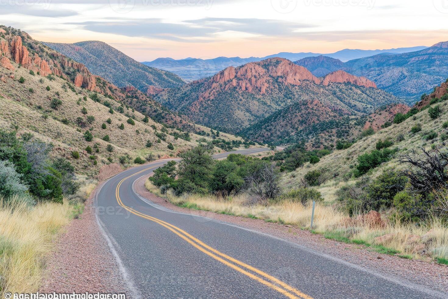 Winding mountain road at dawn photo