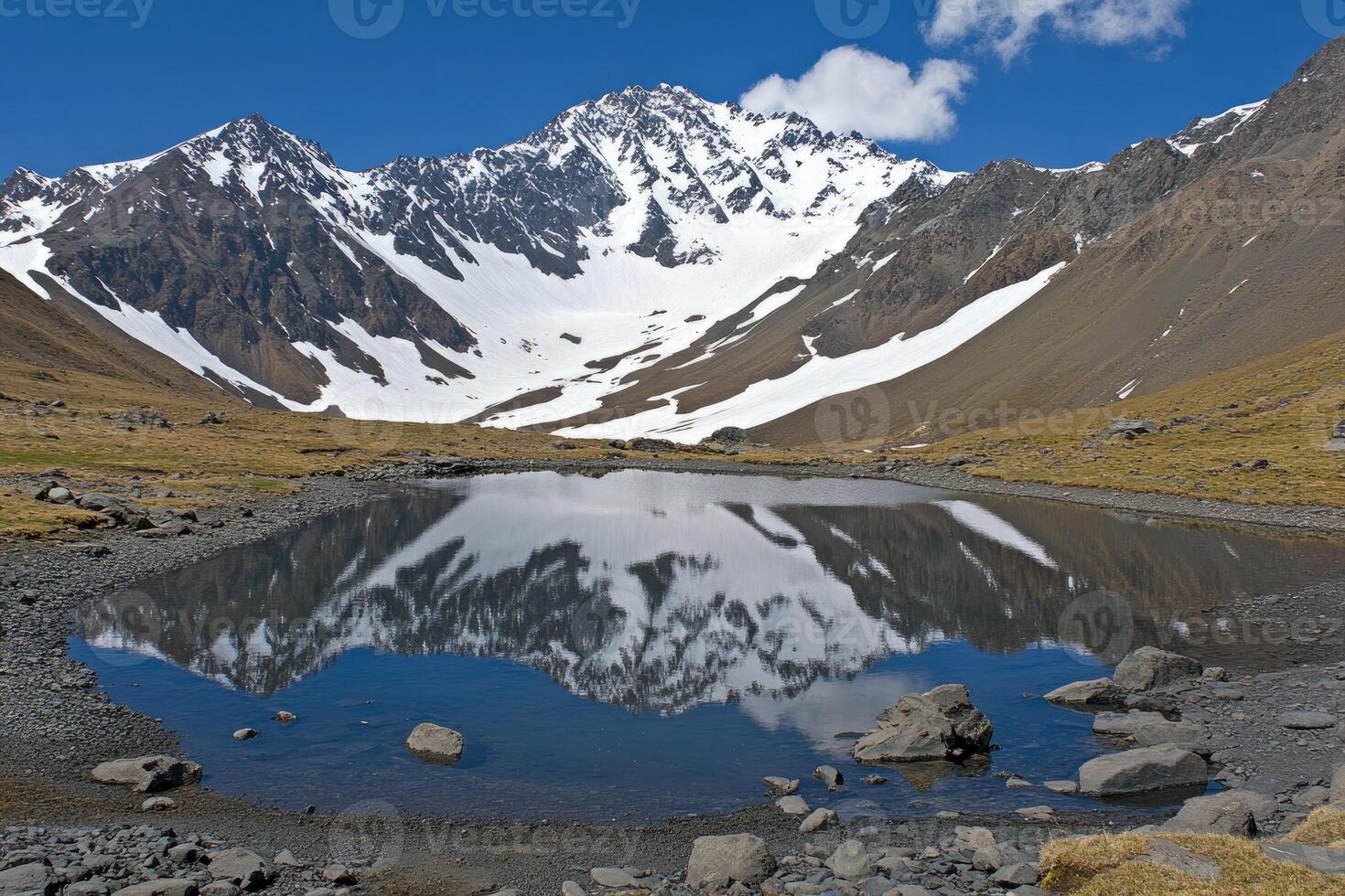 Mountain lake reflecting peak photo